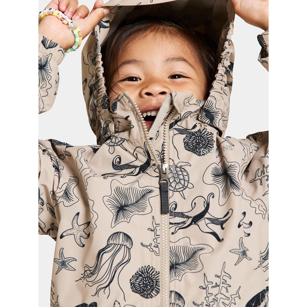 Didriksons Dětská nepromokavá bunda Norma ocean beach beige - ROSTOUCÍ